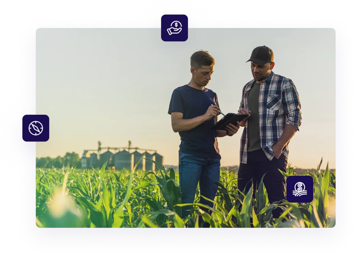 Two male small business owners discussing and reviewing USDA rural development loans on a tablet device